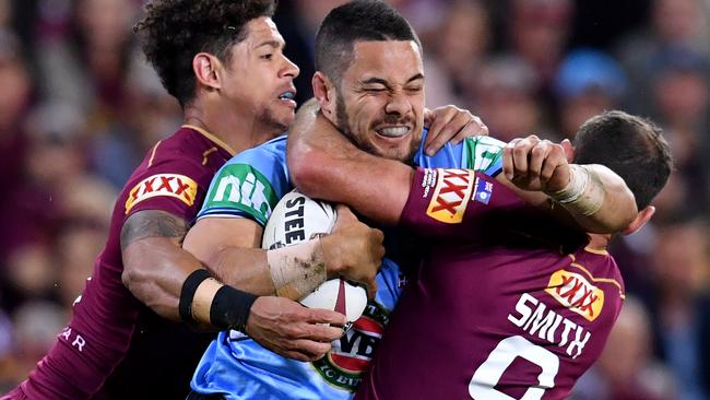 Jarryd Hayne is tackled by Cameron Smith and Dane Gagai in a 2017 Origin match.