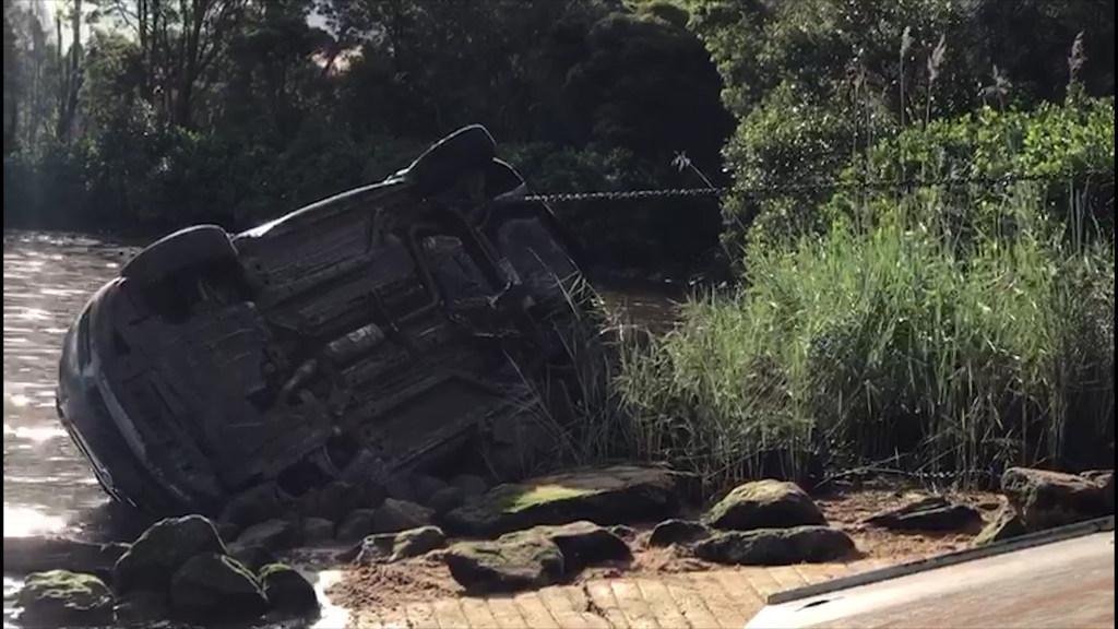  Police divers pull car out of the water