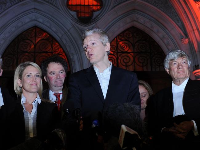 Wikileaks founder Julian Assange stands with his legal team, including Geoffrey Robertson. Picture: AFP/Adrian Dennis