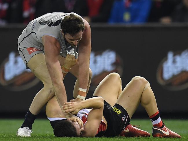 Jed Lamb makes contact with Saint Jade Gresham’s face during a second-term scuffle. Picture: AAP