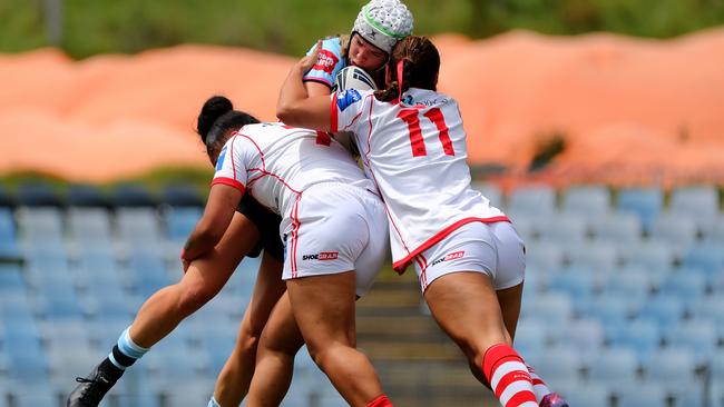 Sophia Griffin of the Sharks is tacked by Latisha Smythe of the Dragons during the Tarsha Gale Cup.