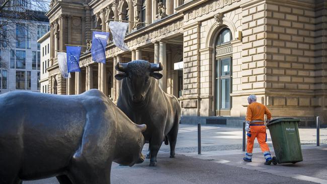 Bull and a bear statues outside the Frankfurt Stock Exchange in Germany. German authorities have been investigating ways to get the country’s economy moving while containing coronavirus infections. Picture: Getty Images