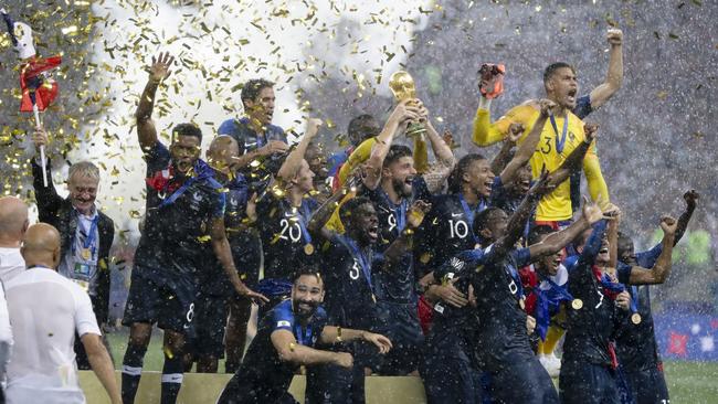 France players hold up the World Cup trophy after their 4-2 World Cup final victory over Croatia at the Luzhniki Stadium in Moscow, Russia. Photo: AP