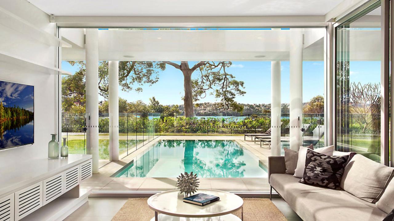 The bright and airy living room overlooks the pool. Picture: Matrix