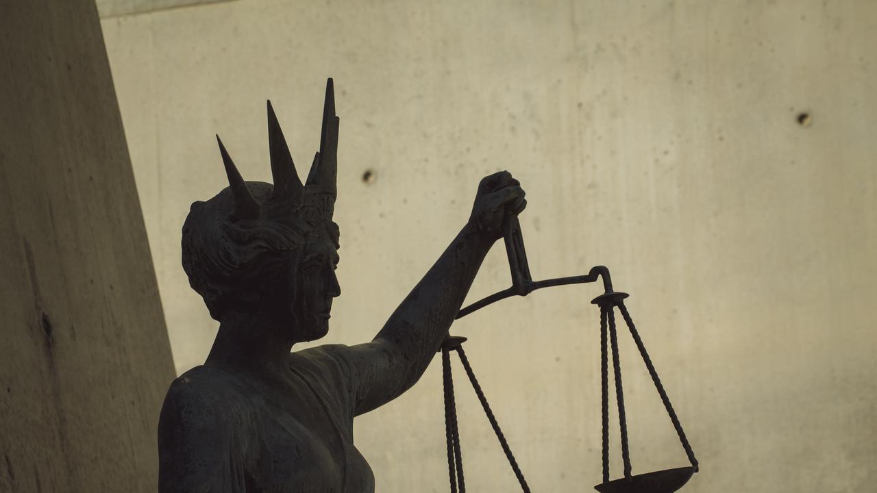 The scales of justice stature outside Brisbane Supreme Court in the Brisbane CBD. Picture: NewsWire / Glenn Campbell