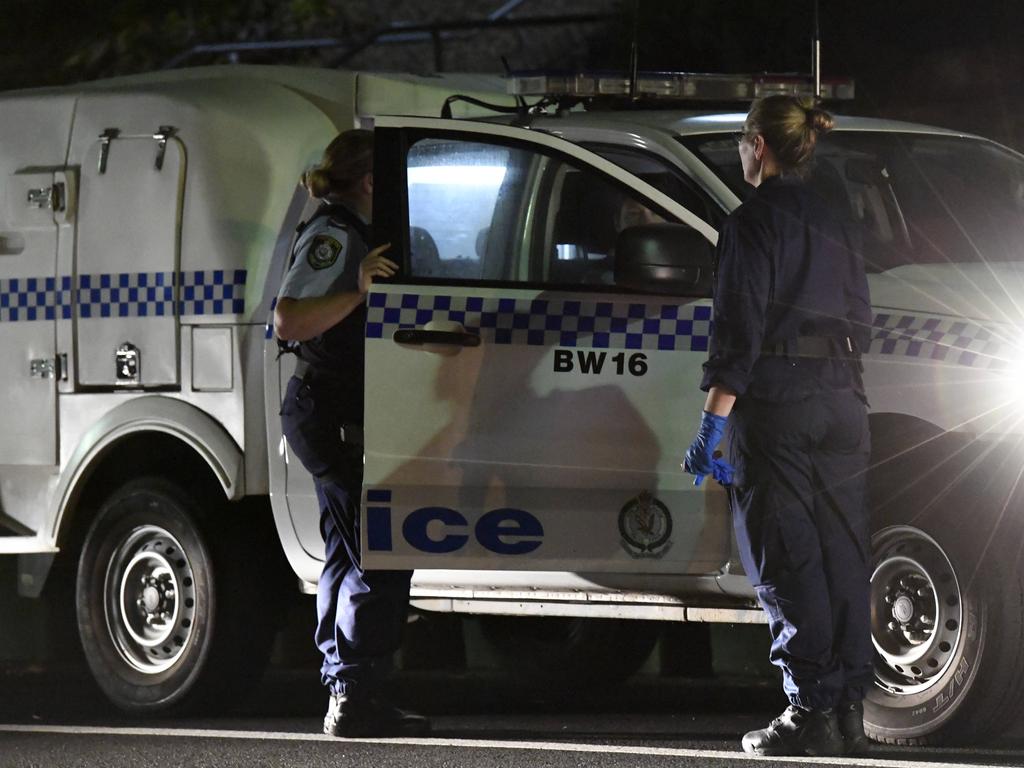 Police outside the unit where Larry White murdered. Picture: Gordon McComiskie