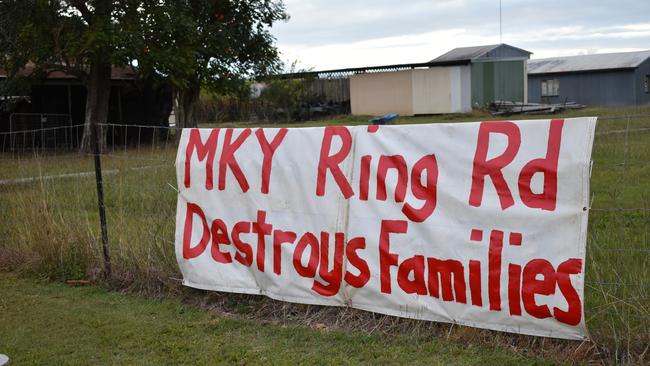 Families whose land was resumed by the Mackay Ring Road set up a sign protesting the overpass opening on Friday, September 4, 2020.