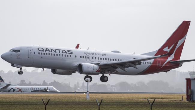 SYDNEY, AUSTRALIA - NewsWire Photos May 6, 2021: A Qantas aircraft landing at Sydney Airport.Picture: NCA NewsWire / James Gourley