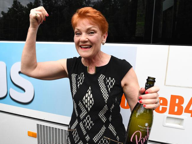 One Nation leader Pauline Hanson is seen after popping a bottle of champagne before boarding the One Nation 'Battler Bus' in Brisbane, Monday, November 6, 2017.  Hanson will conduct a regional tour of the state speaking to residents about the major issues for them leading into the  Queensland election campaign. (AAP Image/Dave Hunt) NO ARCHIVING