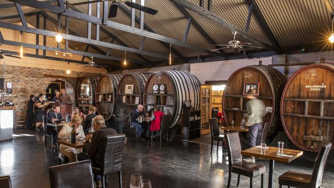 Surrounded by oak barrels, diners at The Barrelroom, at Ballandean enjoy lunch. Picture: Mark Cranitch.