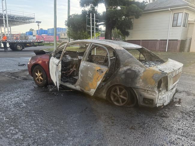 Stolen car torched and dumped in industrial precinct