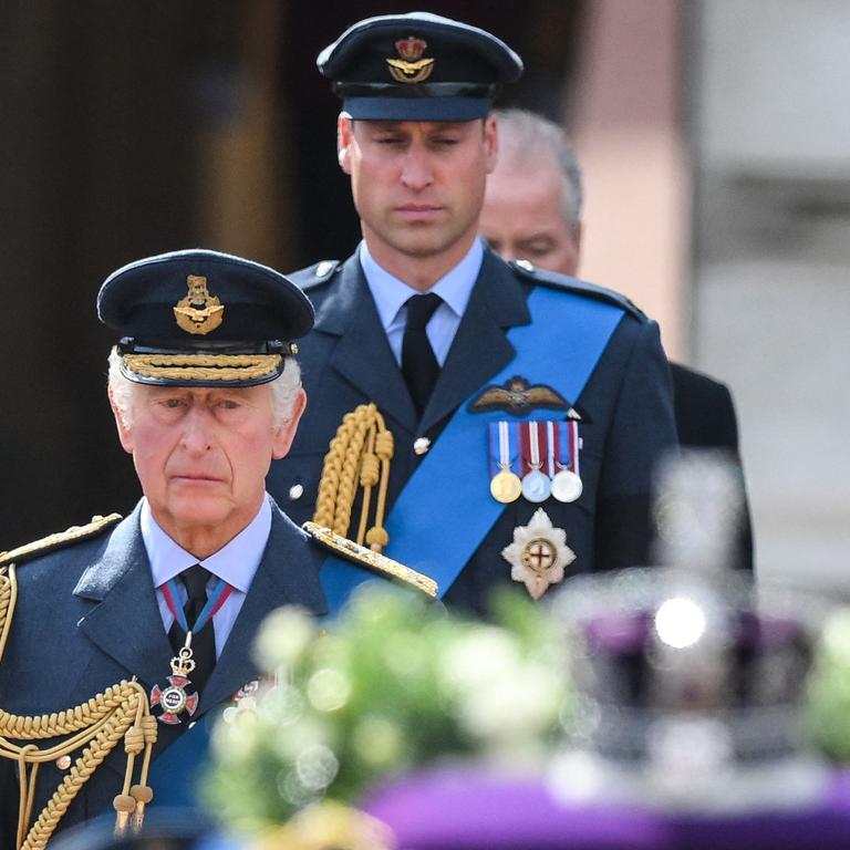 Britain's King Charles III and Britain's Prince William, Prince of Wales walk behind the coffin of Queen Elizabeth II. (Photo by Daniel LEAL / POOL / AFP)