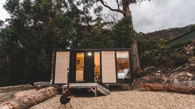 Tiny Away's newest tiny home Pirates Retreat is nestled on a hill that is surrounded by trees and overlooks the ocean at Eaglehawk Neck. Photo: Supplied by Tiny Away