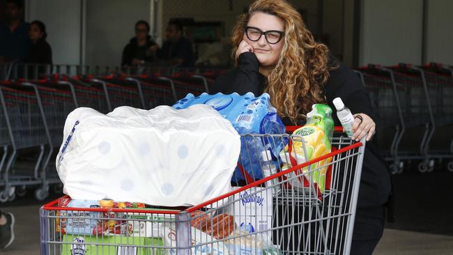 Mia Gaitanidis stocked up on water, disinfectant and paper towels at Costco Melbourne. Picture: David Caird