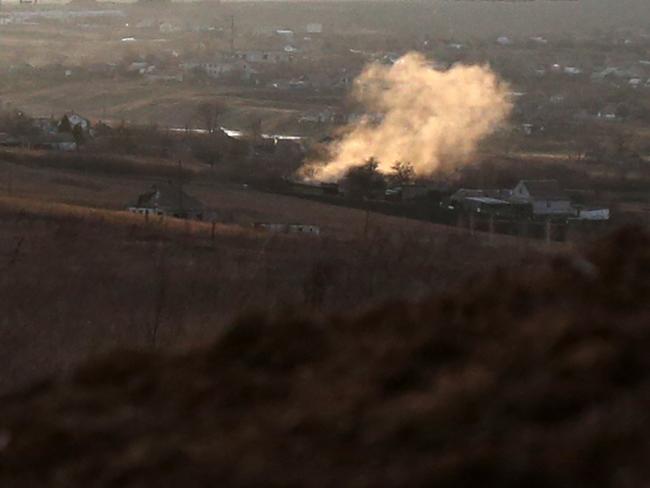 Smoke rising from an explosion after a shelling in Novohnativka village, Donetsk region, not far from position of Ukrainian Military Forces on the front line with Russia backed separatists. Picture: AFP