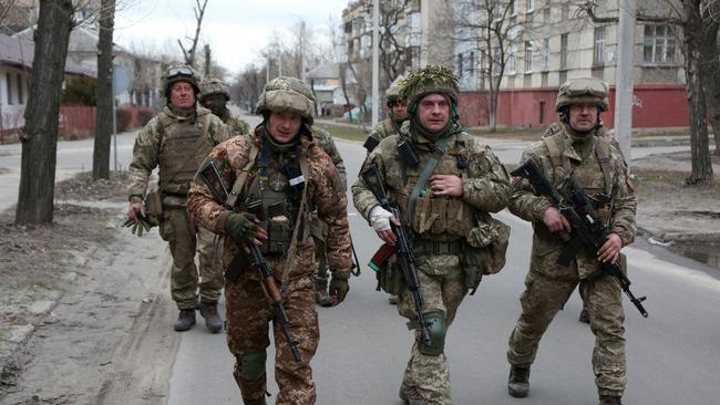 Servicemen of Ukrainian Military Forces walk in the small town of Severodonetsk, Donetsk Region. Picture: AFP