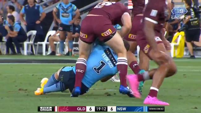 Queensland's Jai Arrow attacks a concussed James Tedesco. Picture supplied