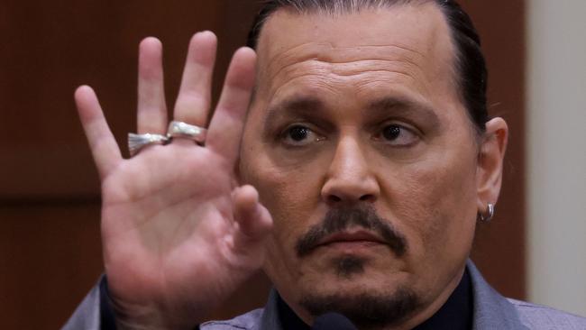 Johnny Depp displays the middle finger injured while he and his ex-wife Amber Heard were in Australia in 2015. Picture: AFP