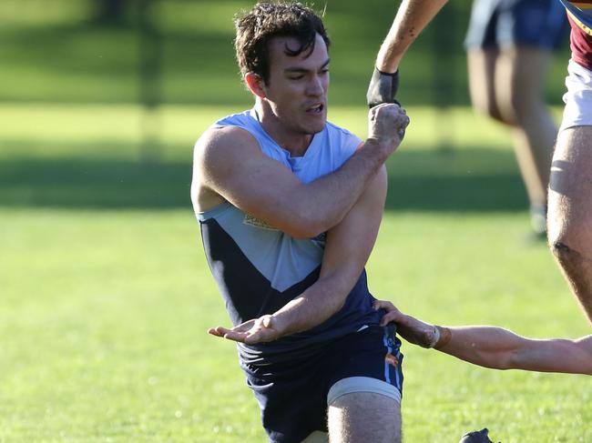 July 20, 2019 VAFA (Premier C): Old Camberwell v Marcellin. 25 Harry Crothers for Old Camberwell gets a handball away.Picture: Stuart Milligan