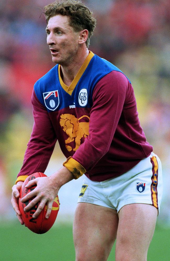 Craig Lambert takes a kick for Brisbane.