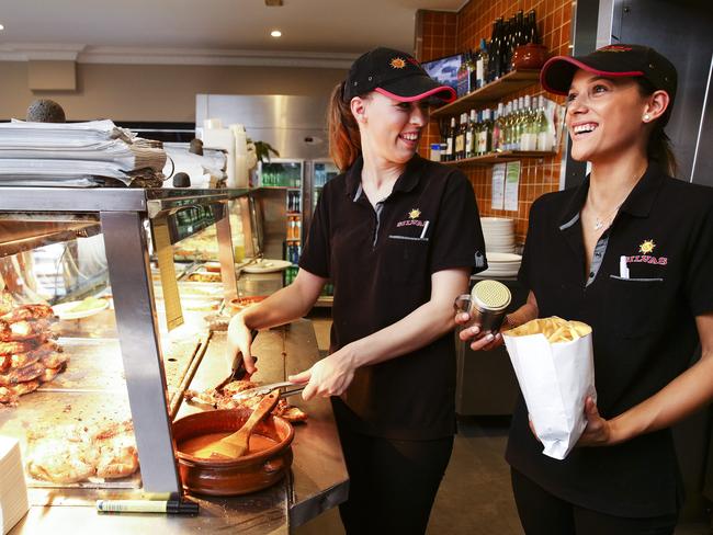 Marina Moreira and Veronica Abreu working at Silvas Portuguese chicken shop in Petersham. Picture: Justin Lloyd