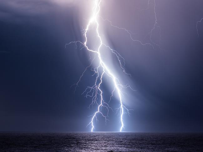 EMBARGO FOR TWAM 08 OCTOBER 2022. FEE MAY APPLY.  Lightning over the ocean at Port Macquarie. Photo: Will Eades/Supplied