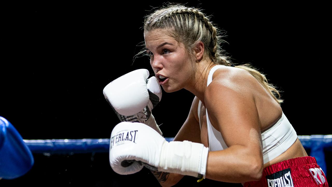 Queensland professional boxer Taylah Robertson (white gloves) fights Logan-based fighter Mai Nixon.  Photo: Andrew Davies.