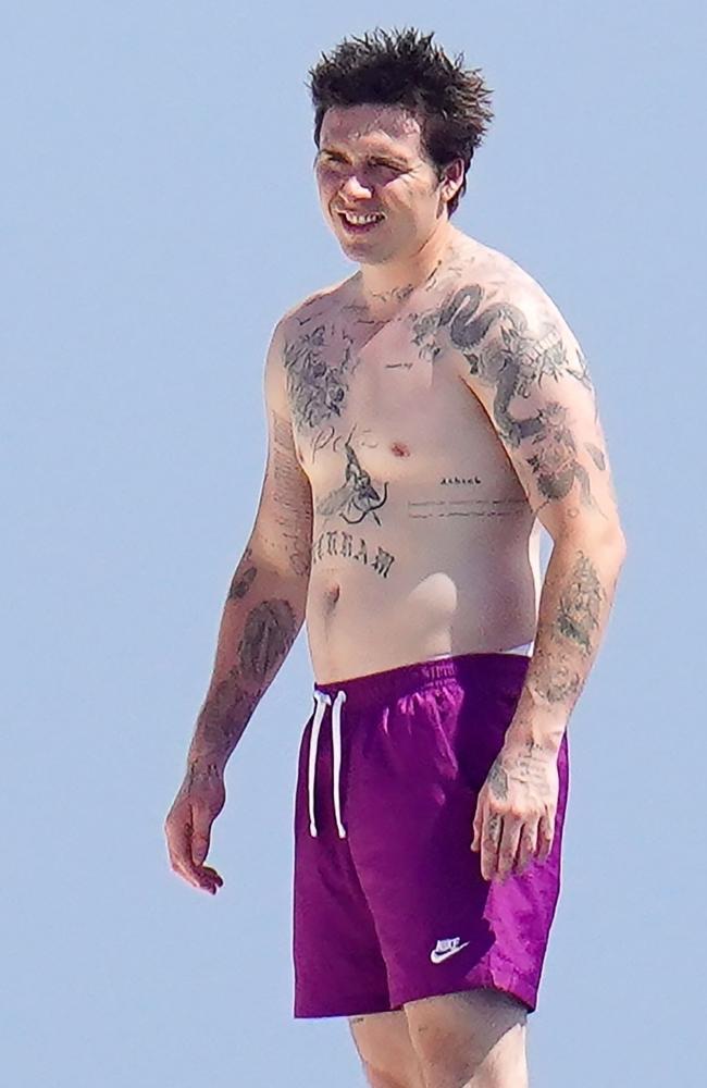 Beckham, the oldest son of David and Victoria Beckham, wasted no time stripping down for a dip. Picture: Backgrid