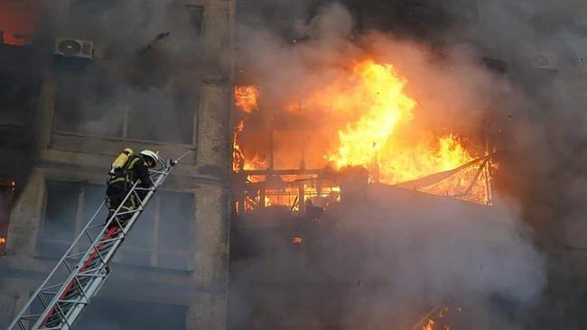 Firemen work to extinguish a fire in a housing block hit by shelling in the Sviatoshynsky district in western Kyiv. Picture: AFP / State Emergency Service of Ukraine