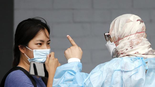 BRISBANE, AUSTRALIA - NewsWire Photos - JANUARY 6TH 2022:  Brisbane residents pictured queuing for testing at the Mater due to the recent Covid-19 Omicron strain outbreak.  Picture: NCA NewsWire / Josh Woning