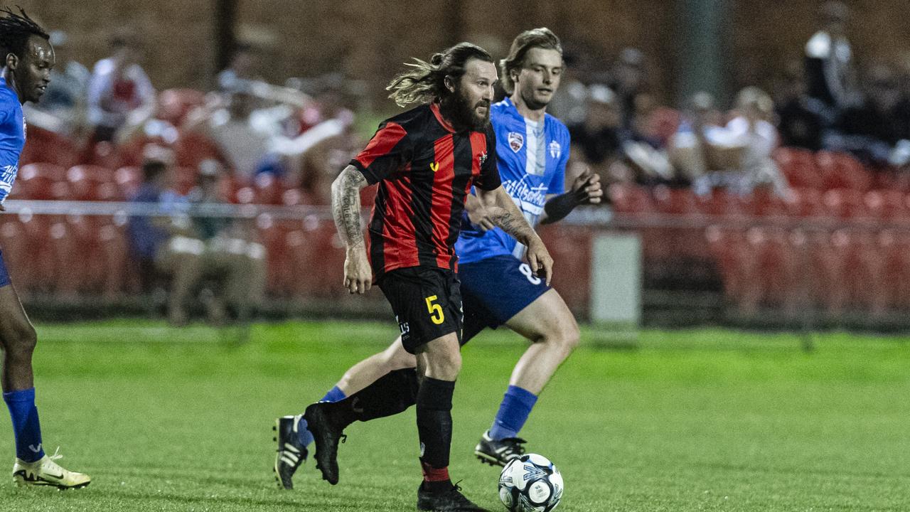 Justin Newby of Gatton Redbacks and Jase Sampson of Rockville Rovers in FQPL3 Darling Downs men grand final at Clive Berghofer Stadium, Saturday, August 31, 2024. Picture: Kevin Farmer