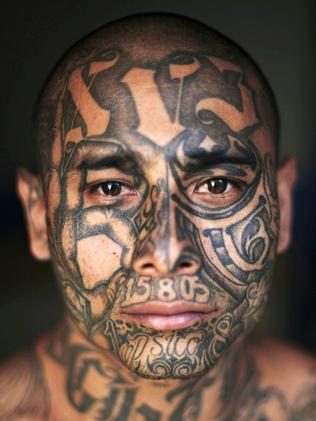 ‘Psycho’, 23, is covered in gang tattoos. Picture: Rodrigo Abd/AFP