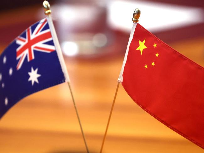 Chinese and Australian flags are displayed on the table where Chinese Foreign Minister Wang Yi and Australian opposition party leader Peter Dutton are due to hold their meeting at Parliament House in Canberra on March 20, 2024. Wang began a whirlwind visit to Australia on his rare trip marking a thaw in relations between the two trading partners. (Photo by DAVID GRAY / AFP)