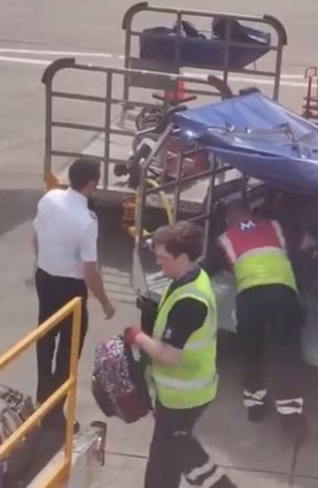 A pilot helped load luggage onto a delayed plane at Edinburgh amid chaotic scenes at airports across the UK. Picture: Twitter