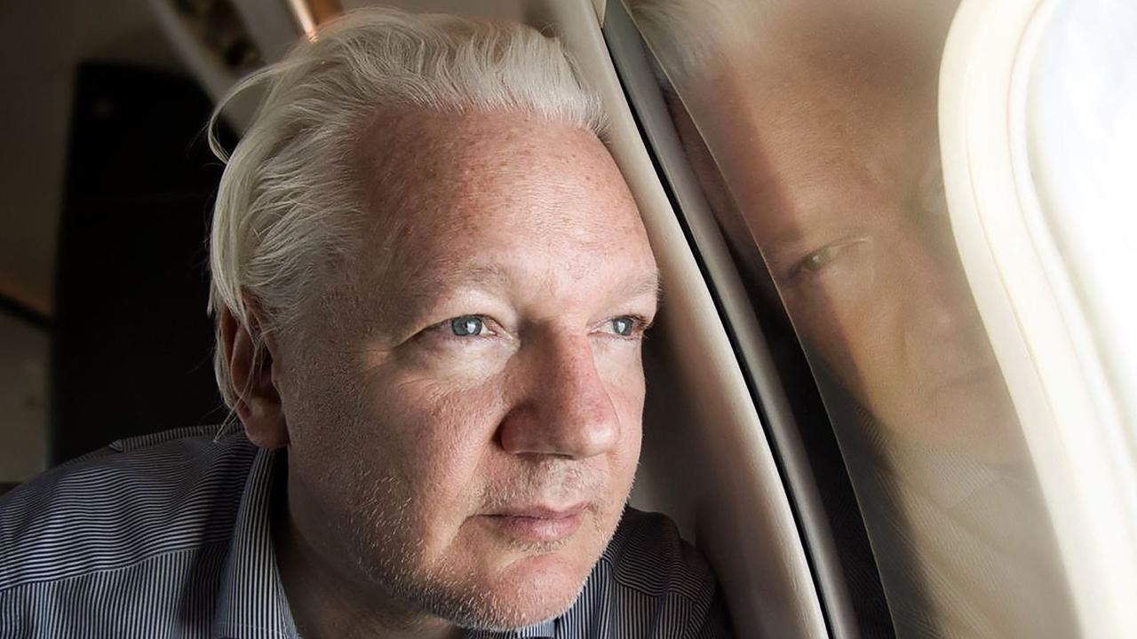 WikiLeaks founder Julian Assange looks out of the window as his plane from London approaches Bangkok for a layover at Don Mueang International Airport in the Thai capital. Picture: WikiLeaks / AFP