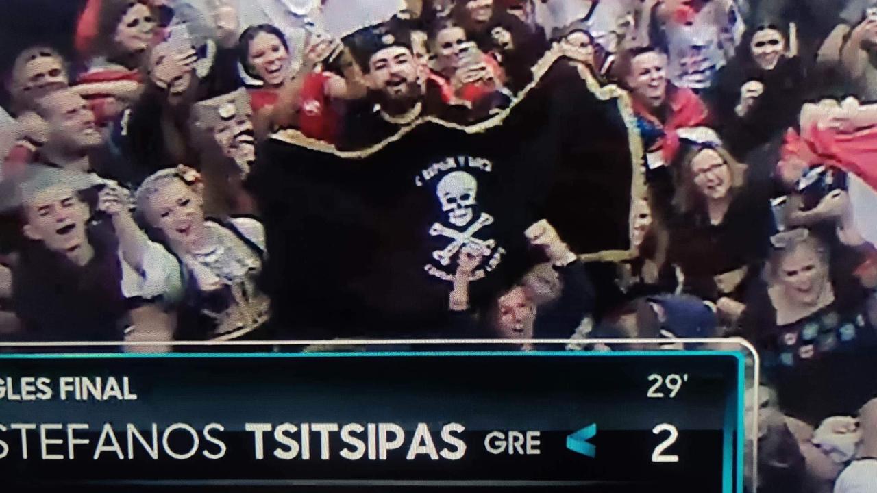 A fan showing off a Serbian nationalist Chetnik flag during the Australian Open men's final.