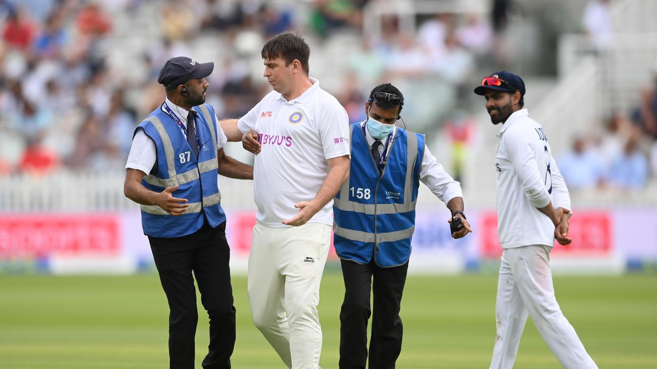 LONDON, ENGLAND - AUGUST 14: A pitch intruder is removed during the Second LV= Insurance Test Match: Day Three between England and India at Lord's Cricket Ground on August 14, 2021 in London, England. (Photo by Mike Hewitt/Getty Images)