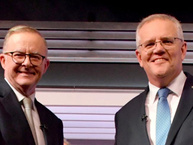 Australian Prime Minister Scott Morrison and Australian Opposition Leader Anthony Albanese shake hands during the third leaders' debate at Seven Network Studios on Day 31 of the 2022 federal election campaign, in Sydney, Wednesday, May 11, 2022. (AAP Image/Mick Tsikas) NO ARCHIVING