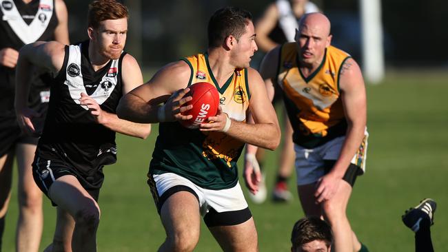 16/05/15 - Division 1 amateur football - Adelaide University versus Salisbury North. Salisbury's Anthony Morgante takes control. Picture Dean Martin