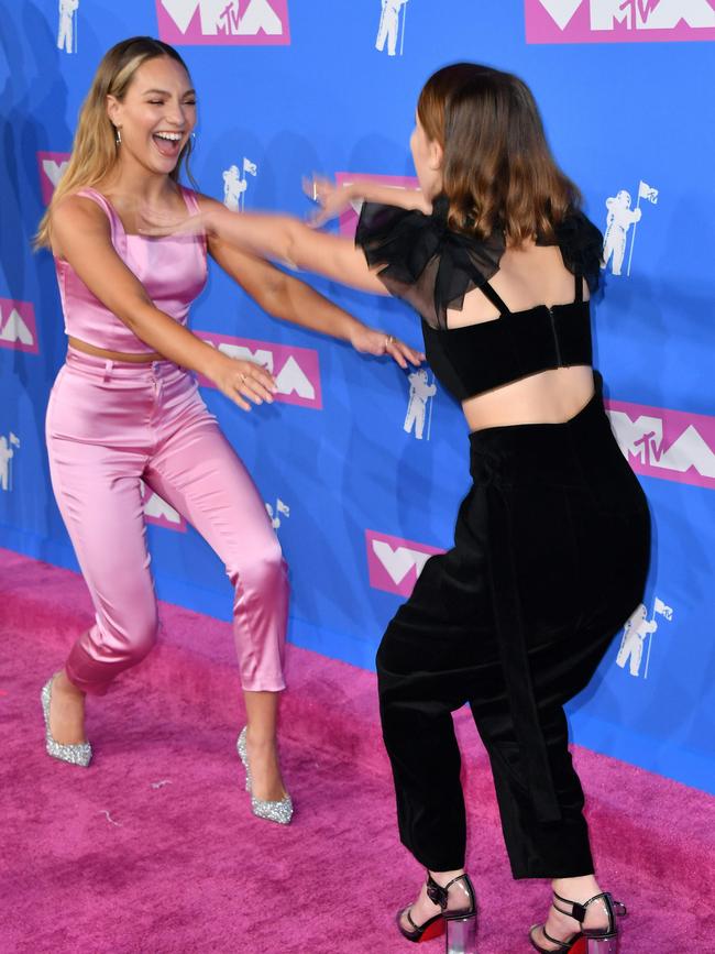 Maddie Ziegler greets Millie Bobby Brown. Picture: AFP