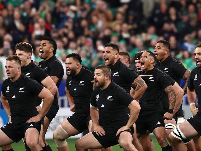 New Zealand players perform the haka ahead of the France 2023 Rugby World Cup quarter-final match between Ireland and New Zealand at the Stade de France in Saint-Denis, on the outskirts of Paris, on October 14, 2023. (Photo by Anne-Christine POUJOULAT / AFP)