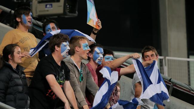 Scotland fans cheer their team on batting.