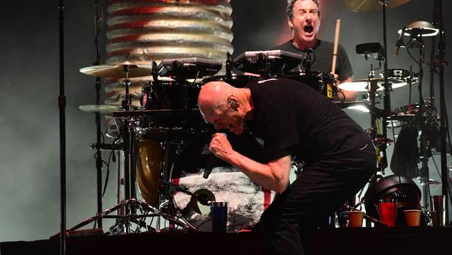 Peter Garrett giving it his all with Midnight Oil. Photo: Supplied / Tony Mott