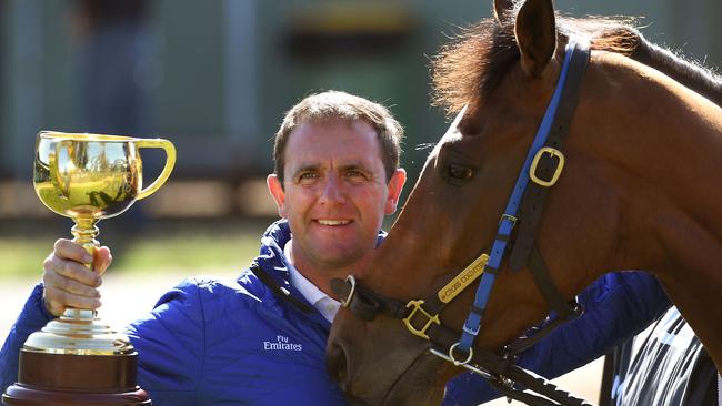 Trainer Charlie Appleby holds the Melbourne Cup with race winner Cross Counter.