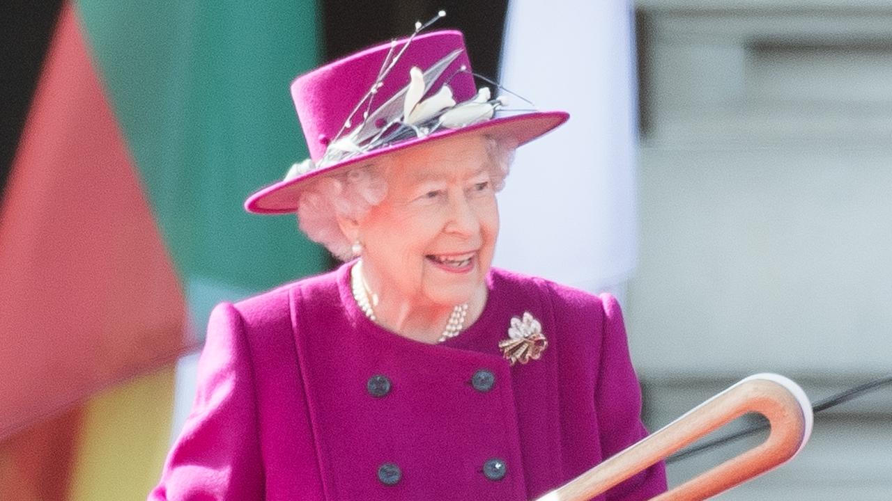 Queen Elizabeth II holds the Commonwealth baton during the launch of The Queen's Baton Relay for the XXI Commonwealth Games being held on the Gold Coast in 2018 at Buckingham Palace on March 13, 2017 in London, England. Picture: Samir Hussein/Samir Hussein/WireImage