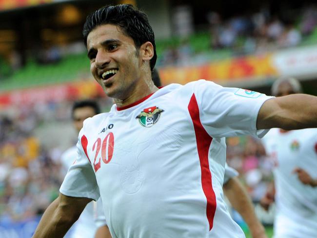 Hamza Aldaradreh of Jordan celebrates his third goal during the Group D Asian Cup football match between Palestine and Jordan in Melbourne on January 16, 2015. AFP PHOTO / MAL FAIRCLOUGH IMAGE RESTRICTED TO EDITORIAL USE - STRICTLY NO COMMERCIAL USE