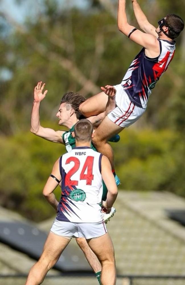 Waverley Blues' Sonny Doherty soars for a screamer. Picture: Field of View Photography