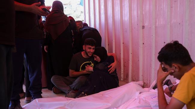 People mourn over shrouded bodies of victims of Israeli strikes on Jabalia. Picture: AFP