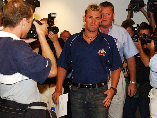 Shane Warne makes his way into a press conference in after arriving home, after he was thrown out of the World Cup after testing positive for drugs. Picture: AAP