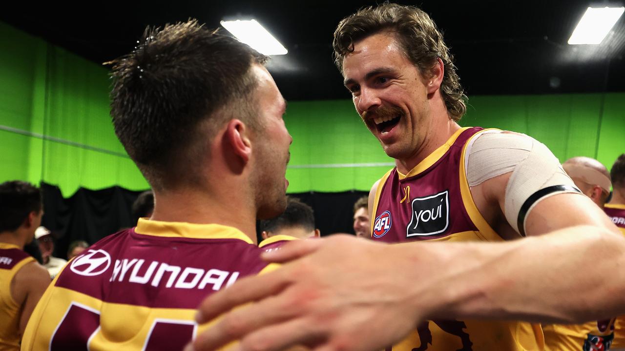 SYDNEY, AUSTRALIA - SEPTEMBER 14: Joe Daniher of the Lions and Lachie Neale of the Lions celebrate in their changeroom after winning the AFL First Semi Final match between GWS Giants and Brisbane Lions at ENGIE Stadium, on September 14, 2024, in Sydney, Australia. (Photo by Cameron Spencer/Getty Images)